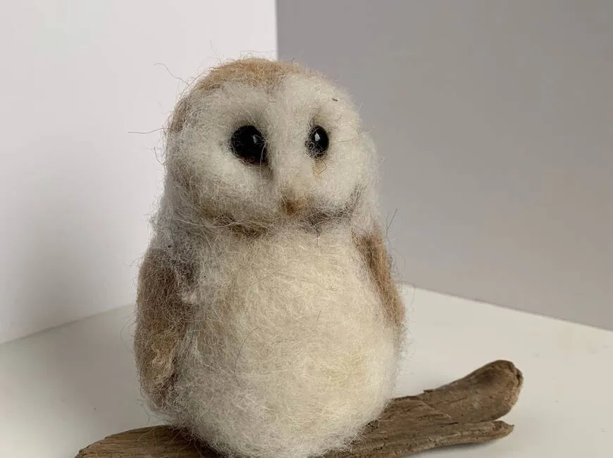 Needle-felted barn owl on driftwood