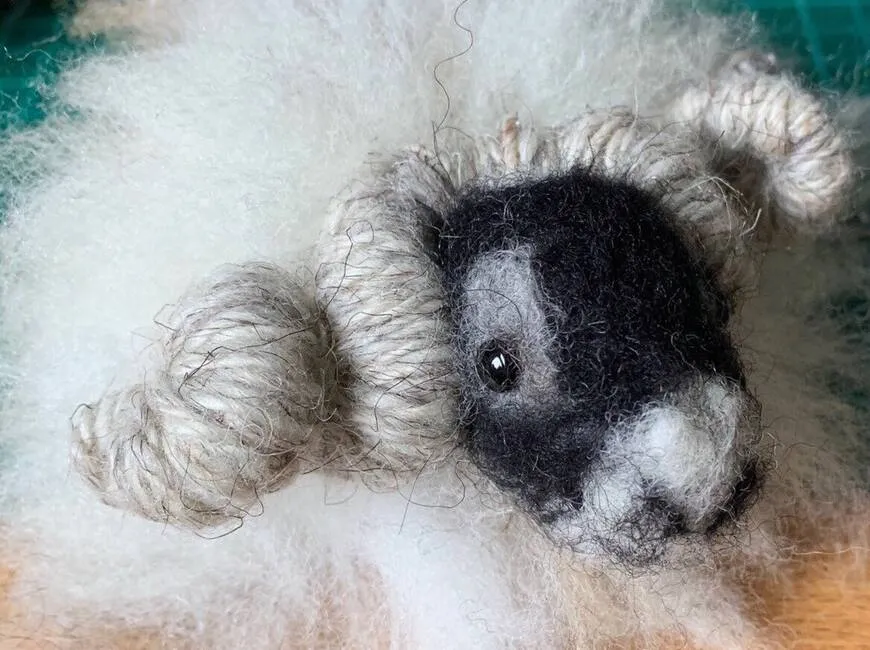 Needle-felted sheep sculpture